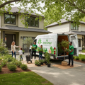 Nursery delivery van with plants being carefully unloaded at a residential home